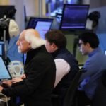 Stock futures were little changed on the busy earnings day; General Motors shares rise on strong results and enhanced outlook
