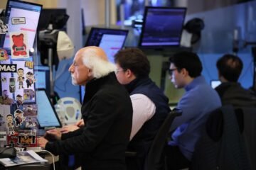 Stock futures were little changed on the busy earnings day; General Motors shares rise on strong results and enhanced outlook