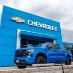 Auto stocks rise as automakers handle policy shifts with “strong” sales.