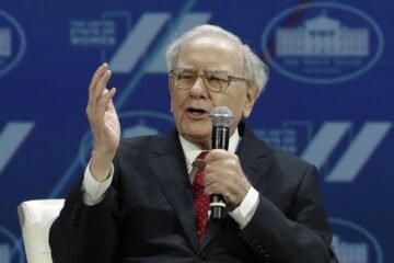 Why does Buffett believe that stock splits may reflect investors’ gains?