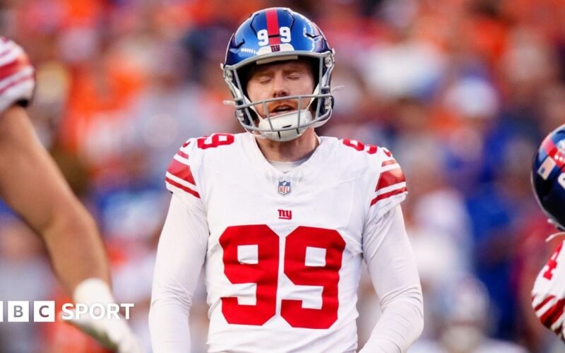 Judd McAtmanney: The New York Giants punt after defeating the Denver Broncos