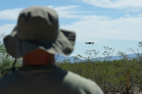A drone used as surveillance technology is flown by a Cochise County law enforcement official, Tuesday, July 29, 2025, in Sierra Vista, Ariz. (AP Photo/Ross D. Franklin)