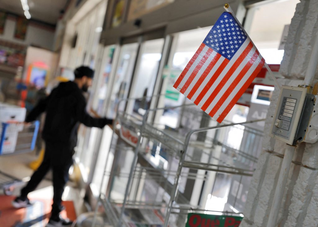 A supermarket employee guards against federal immigration authorities in North Carolina