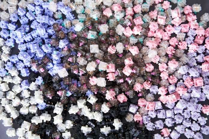 A pile of different keyboard switches photographed from above
