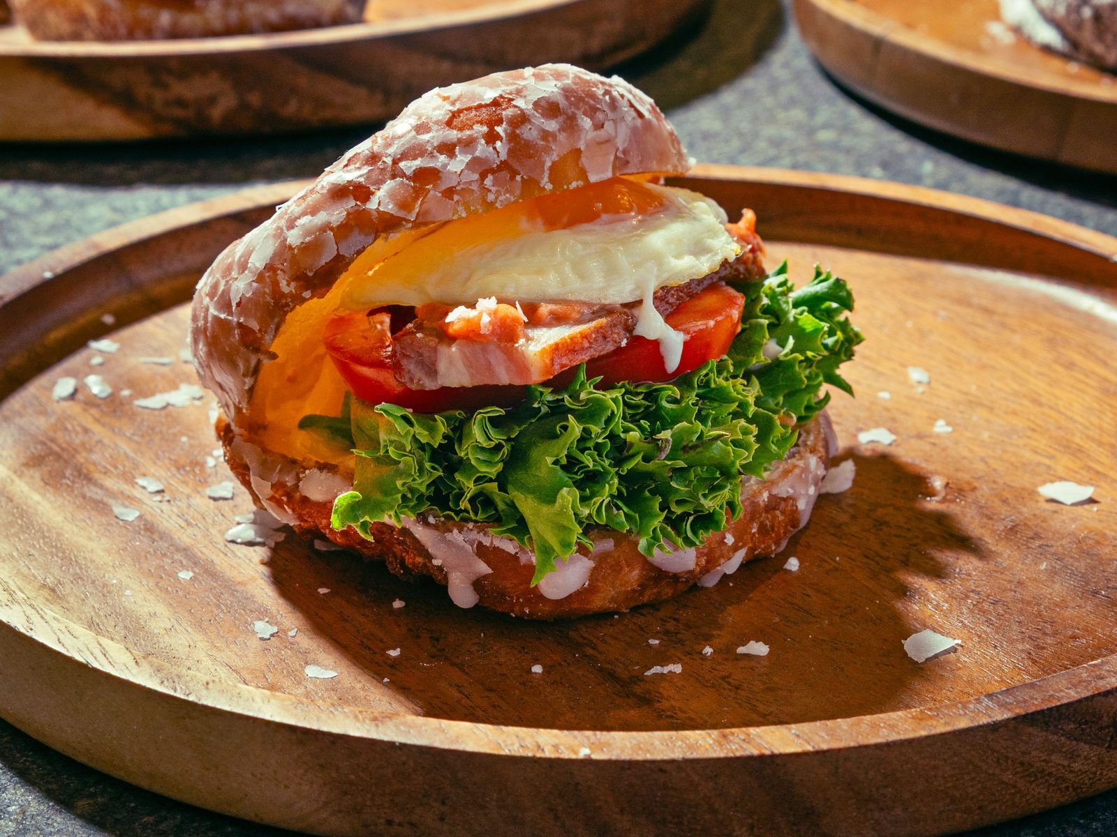 BLT sandwich topped with donuts.