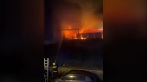 Josh Annetts Flames on the soccer field at night.