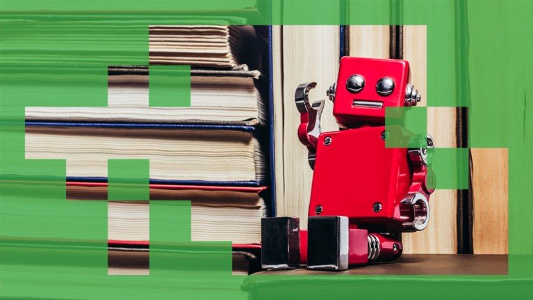 Close up view of a red toy robot sat amongst a stack of books.