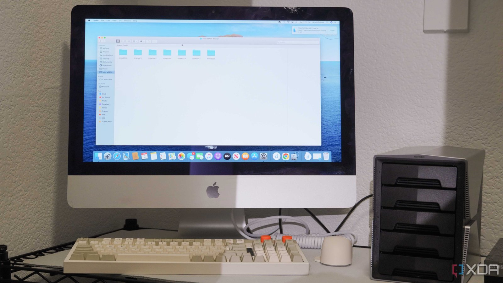 An iMac set up as a NAS in a closet.