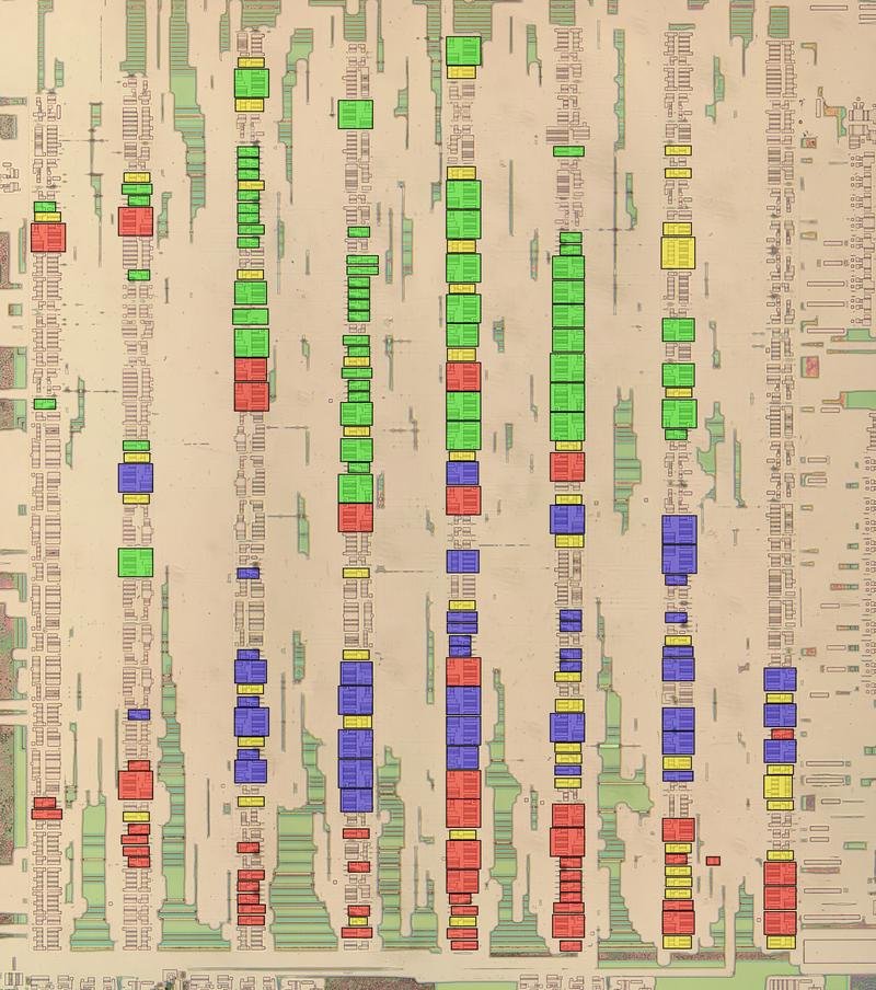 A block of standard-cell logic with multiplexers highlighted. The metal and polysilicon layers were removed for this photo, revealing the silicon transistors.
