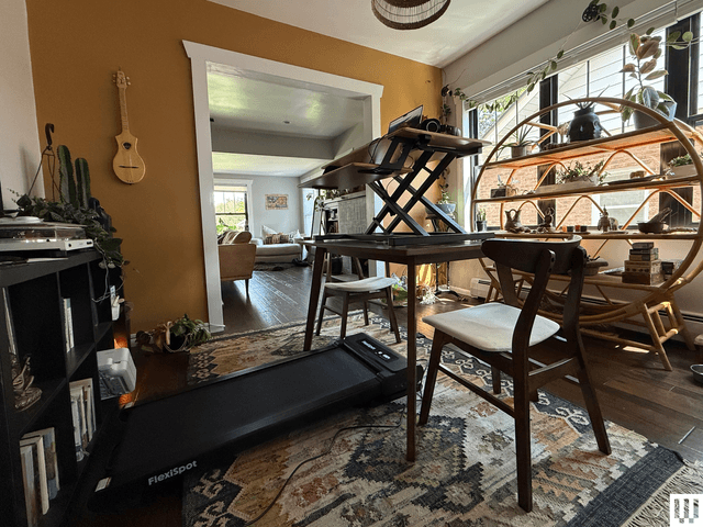 Image may contain: table, chair, furniture, architecture, building, indoor, living room, room, wood and floor