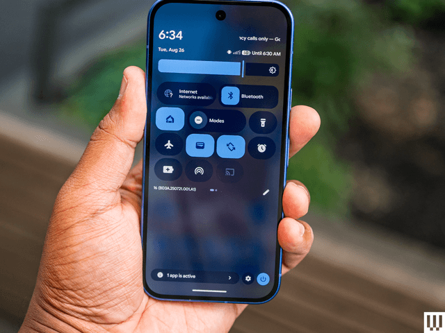 Image may contain: electronics, mobile phone, phone and person