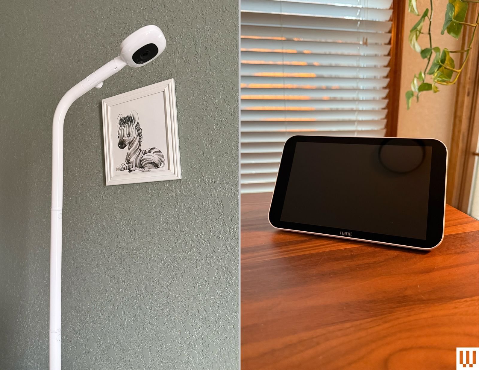 A narrow white column with a camera and a small screen propped on a wooden table at the end