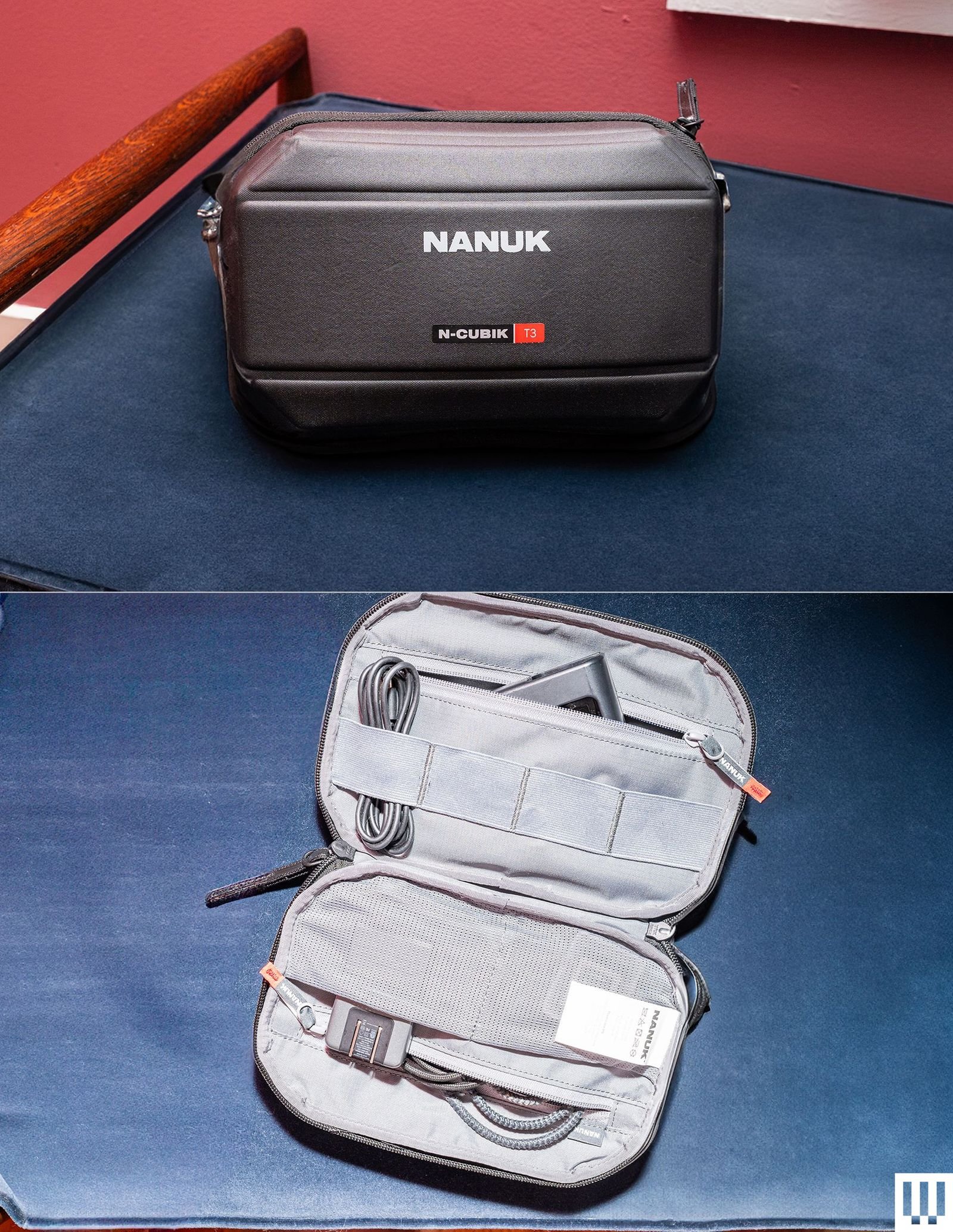 An angular camera gear pouch shown both closed and open laying flat