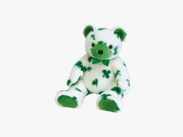 White teddy bear with green clover pattern