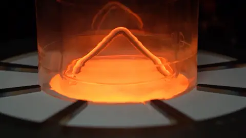 Kromek Amber-coloured cadmium zinc telluride in furnace.