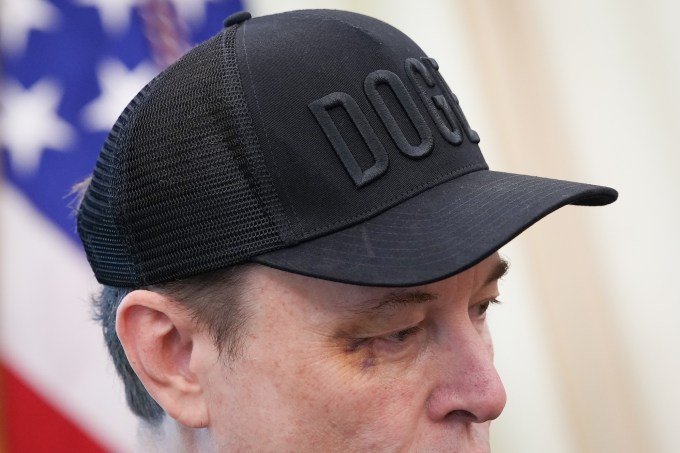 Tesla CEO Elon Musk, with a visible black eye, listens as US President Donald Trump speaks to reporters in the Oval Office of the White House on May 30, 2025