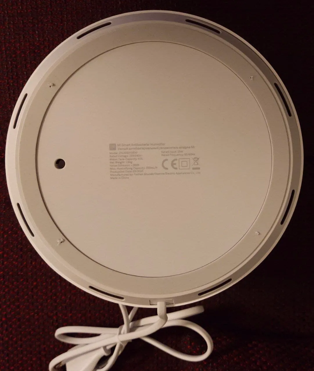 Bottom view of Humidifier. Screws are behind rubber foot ring