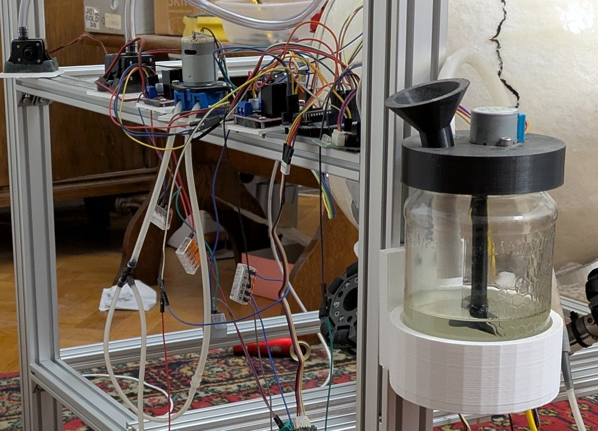 Reward circuit with labeled mixer, pump, valve, and dispenser.