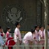 Chinese students wait outside the U.S. Embassy for their visa application interviews, in Beijing on May 2, 2012.