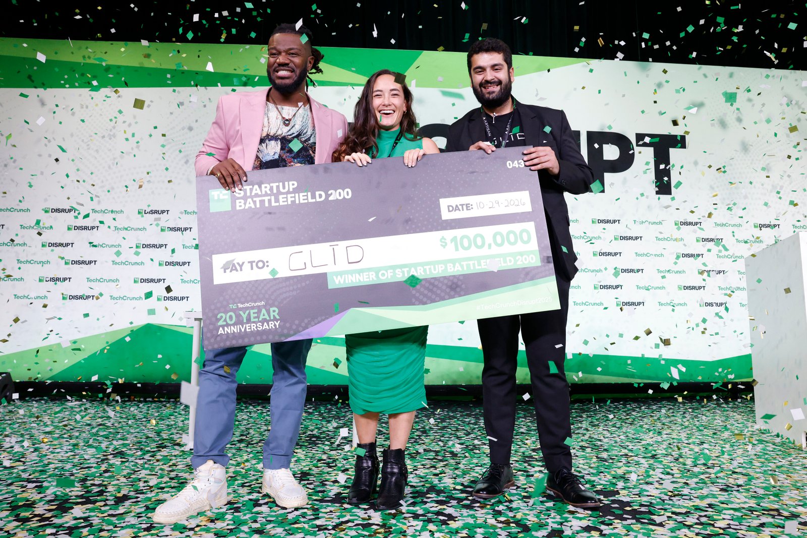 Kevin Damoa, founder and CEO of Glīd, Claire Croft, and Ankit Malhotra, winners of Startup Battlefield 2025, pose on stage during day 3 of TechCrunch Disrupt 2025 at Moscone Center on October 29, 2025 in San Francisco, California.