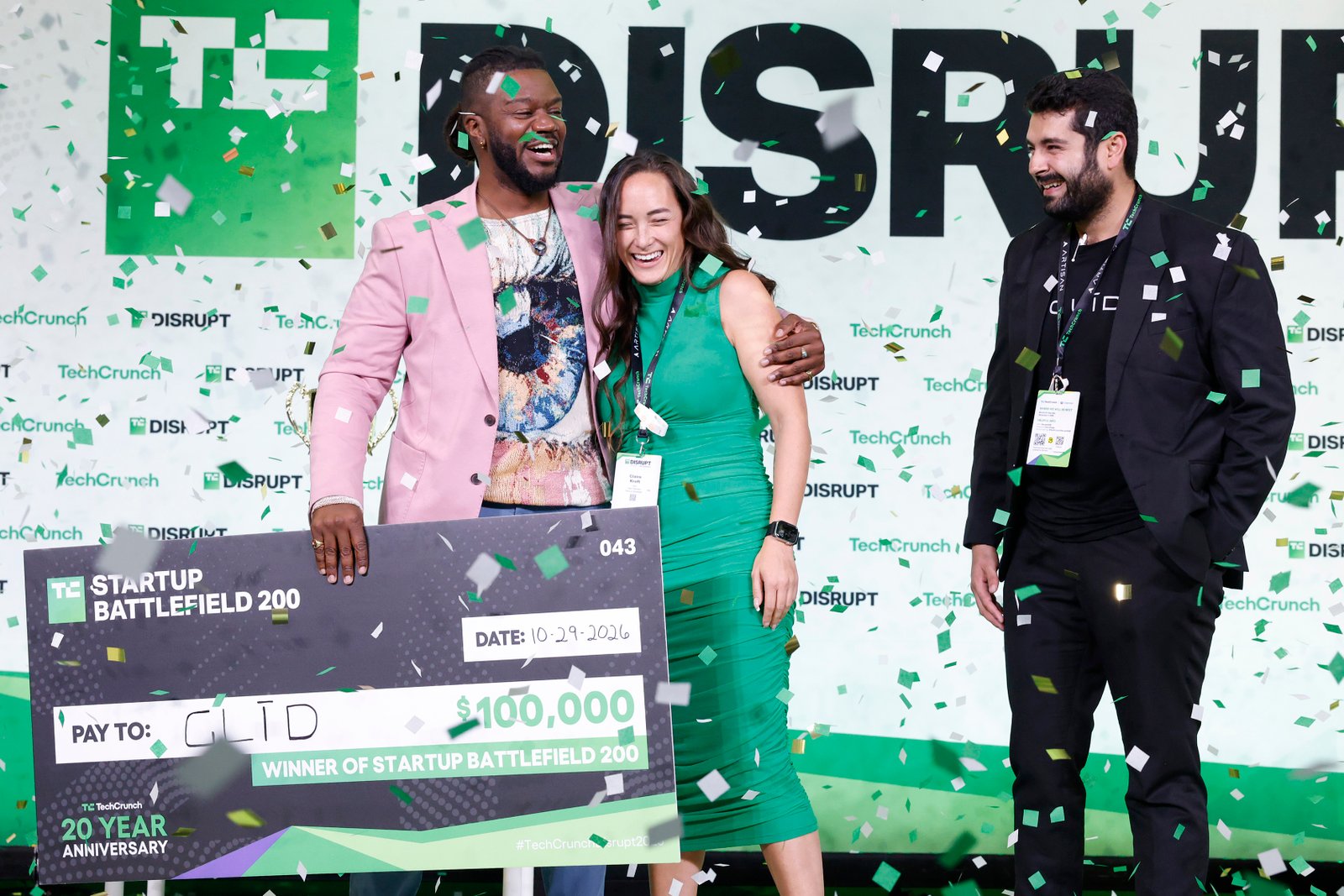 Kevin A. Damoa, founder and CEO of Glīd, Claire Croft, and Ankit Malhotra, winners of Startup Battlefield 2025, pose on stage during day 3 of TechCrunch Disrupt 2025 at Moscone Center on October 29, 2025 in San Francisco, California.