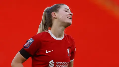 Reuters Liverpool player Marie Hoppinger looks depressed on the field. 
