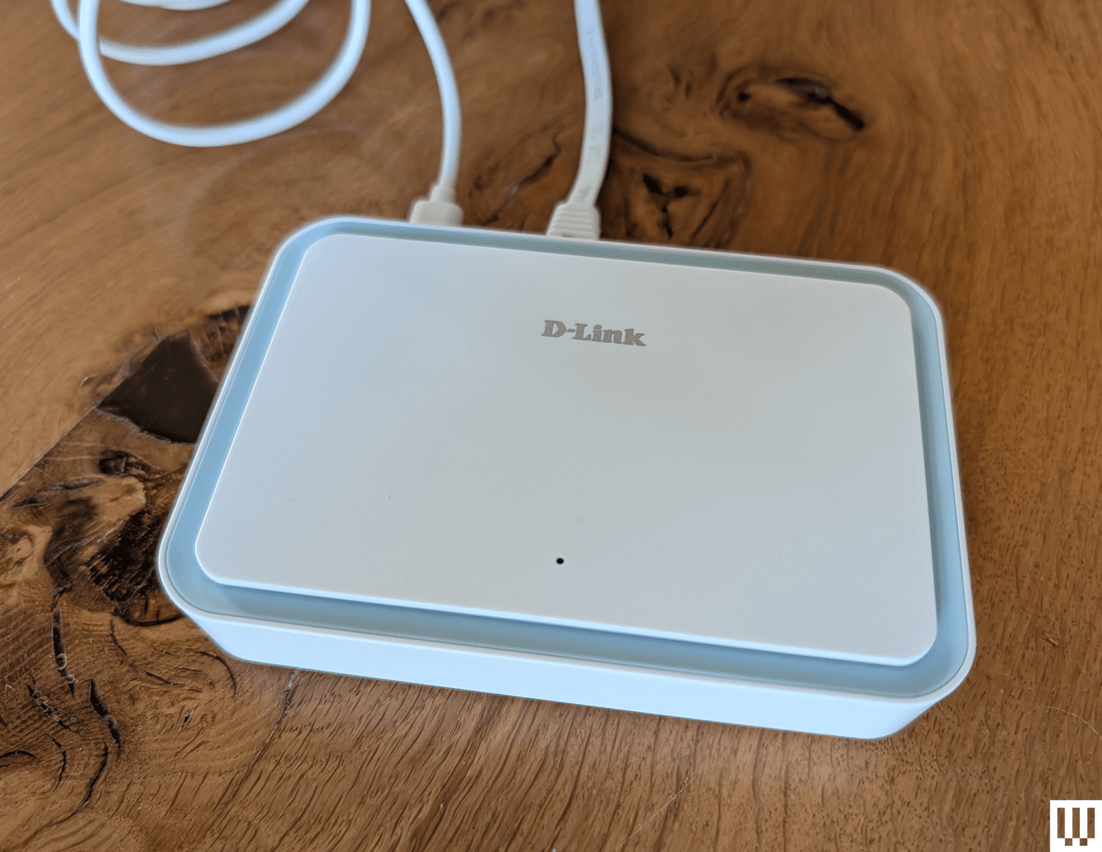 Image may contain Electronics Hardware Router Computer Hardware and Modem