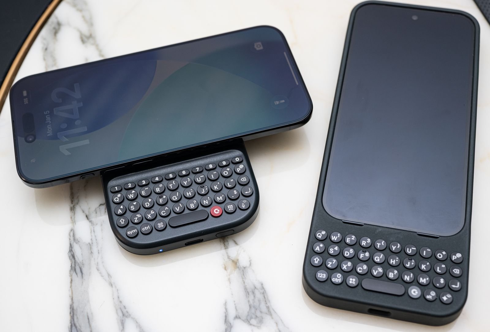 Image may contain electronics, telephone and mobile phone