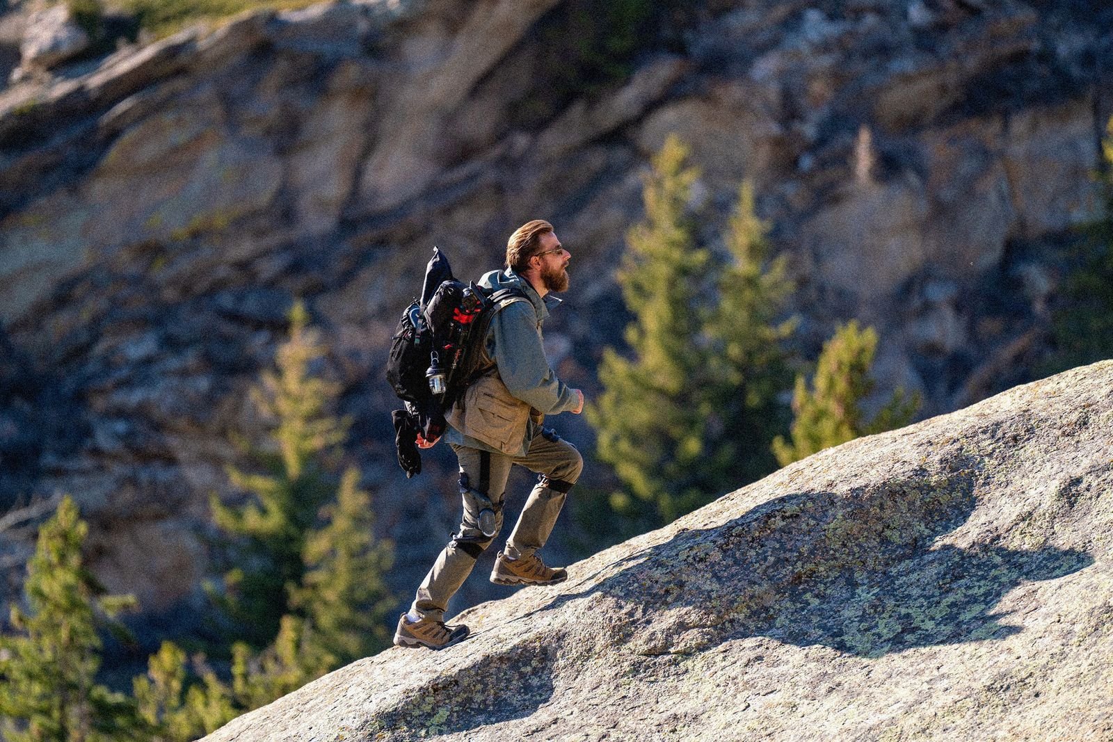 Image may contain: Backpack Backpack Adult Clothes Glove Adventure Hiking and Recreational Activities