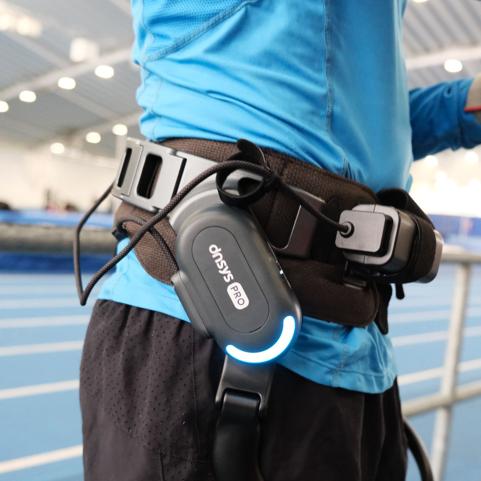 Image may contain accessories, belt, adult figure and electronics