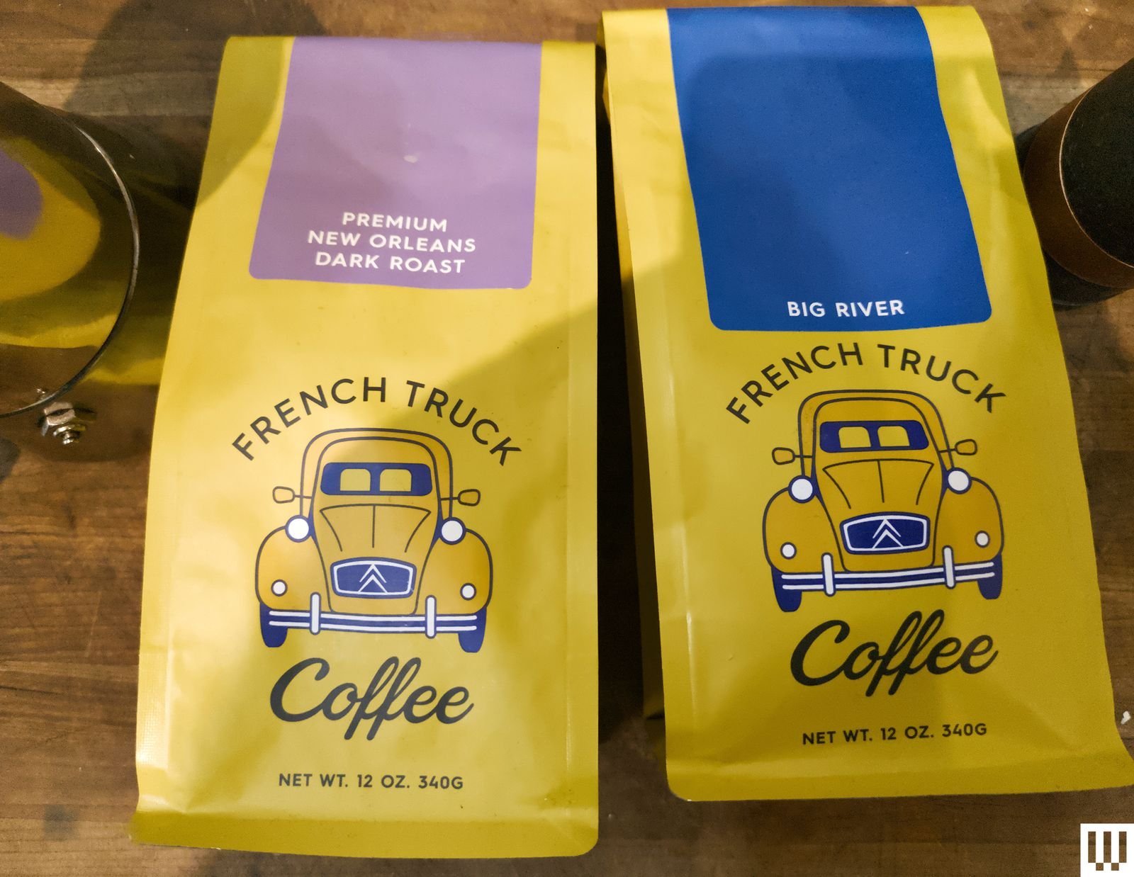 2 yellow bags of coffee from French Truck Coffee Subscription each with an illustration of a yellow truck on the front