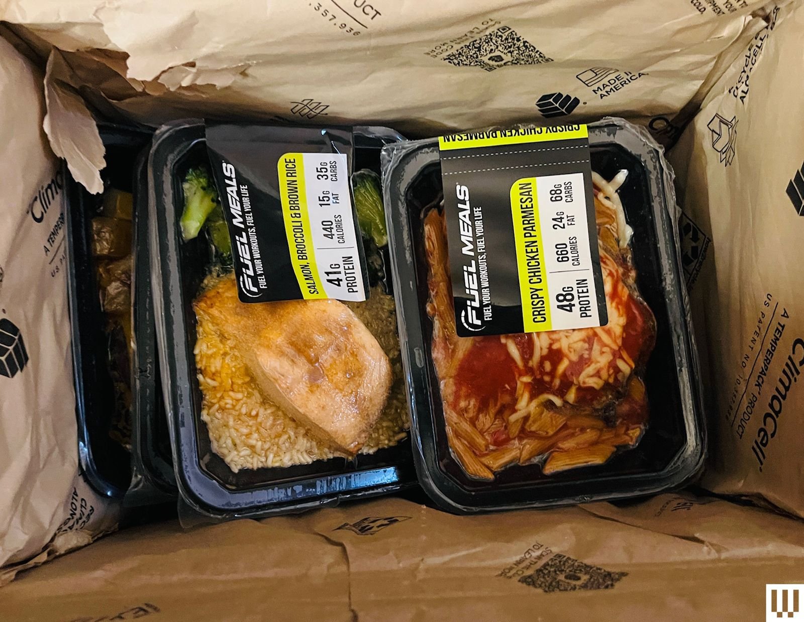 Overhead view of prepackaged meals in a lined cardboard box