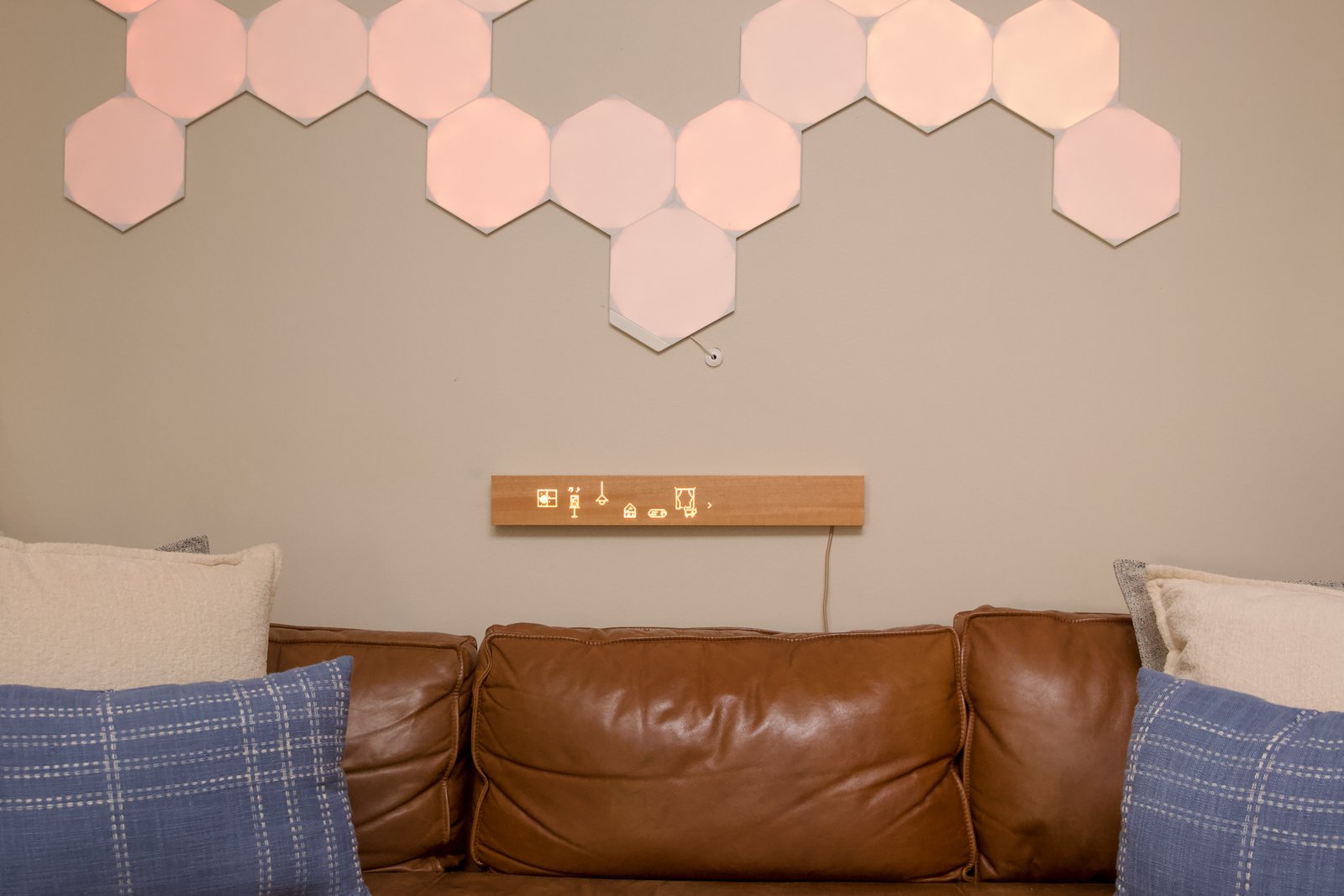 The Mui Pad is a screenless touch interface for smart lights, Sonos speakers, and other devices. I installed it underneath the Nanoleaf panels, which also function as smart home buttons.