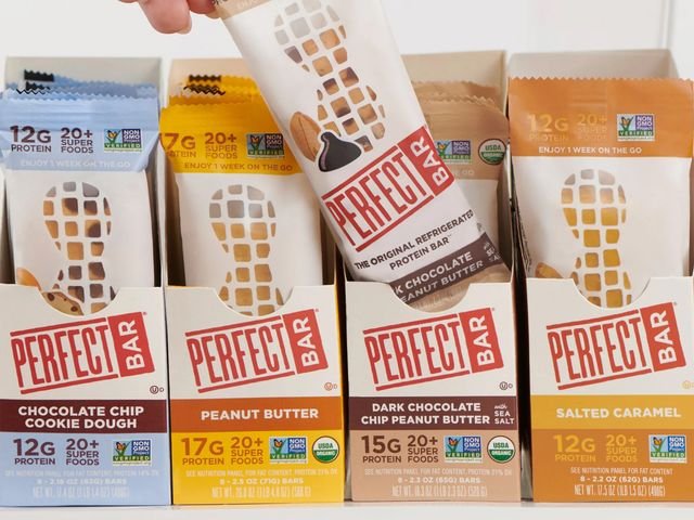 Assorted packages of snacks in rectangular containers