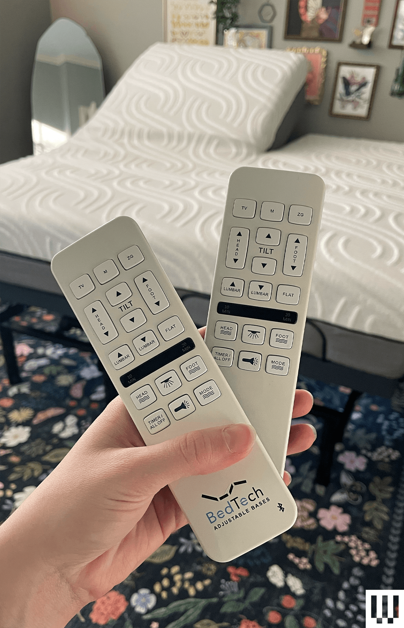 The image may contain furniture, electronics, a remote control, and a bed