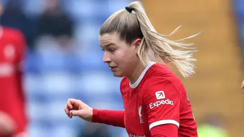 Reuters photo of Liverpool midfielder Marie Hoppinger during a match. She is wearing the club