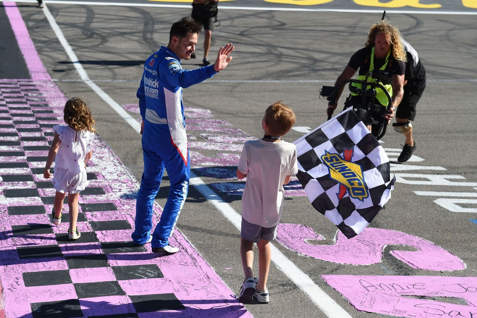 Kyle Larson celebrates with his daughter Audrey and son Owen in Las Vegas. Source: Getty