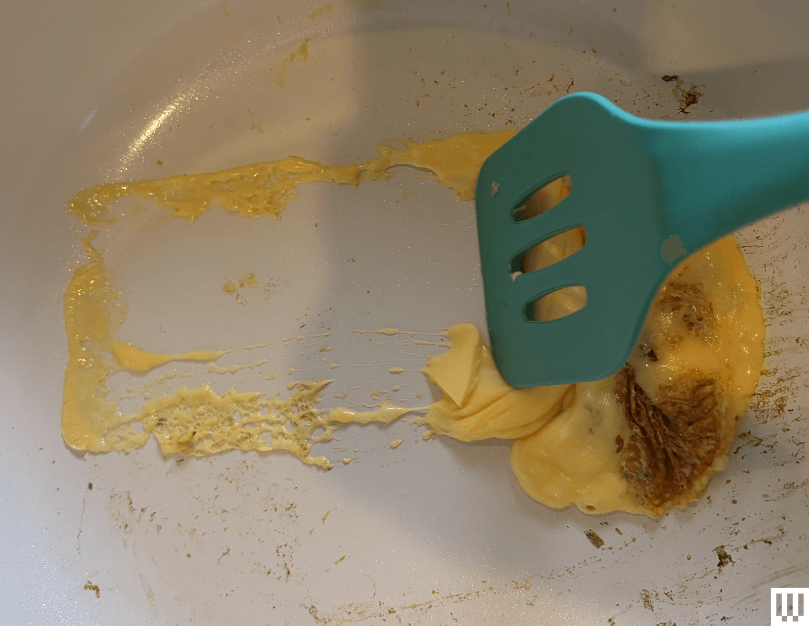 The image may contain kitchen utensils and a spoon