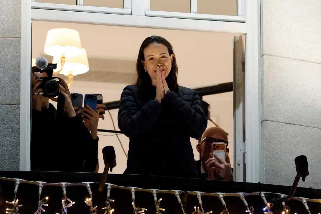Nobel peace laureate Maria Corina Machado greets supporters from a balcony of the Grand Hotel in Oslo, Norway, in the early hours of Dec 11, 2025.