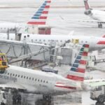 Airlines cancel thousands of flights due to a snow storm that paralyzes the East Coast