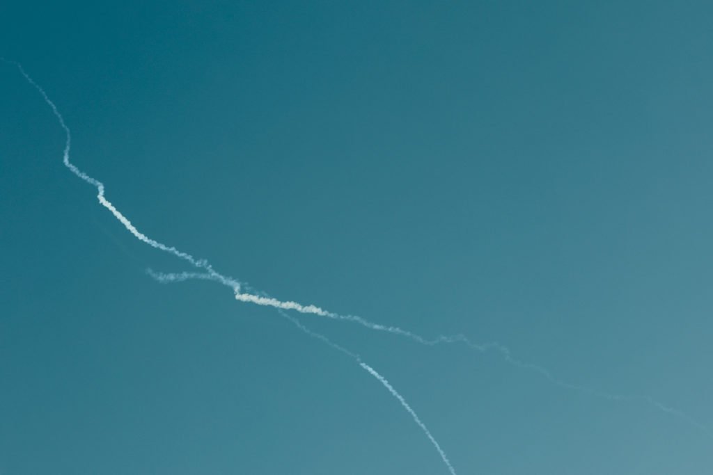 Smoke is left in the sky after reported Iranian missile attacks, following strikes by the United States and Israel against...