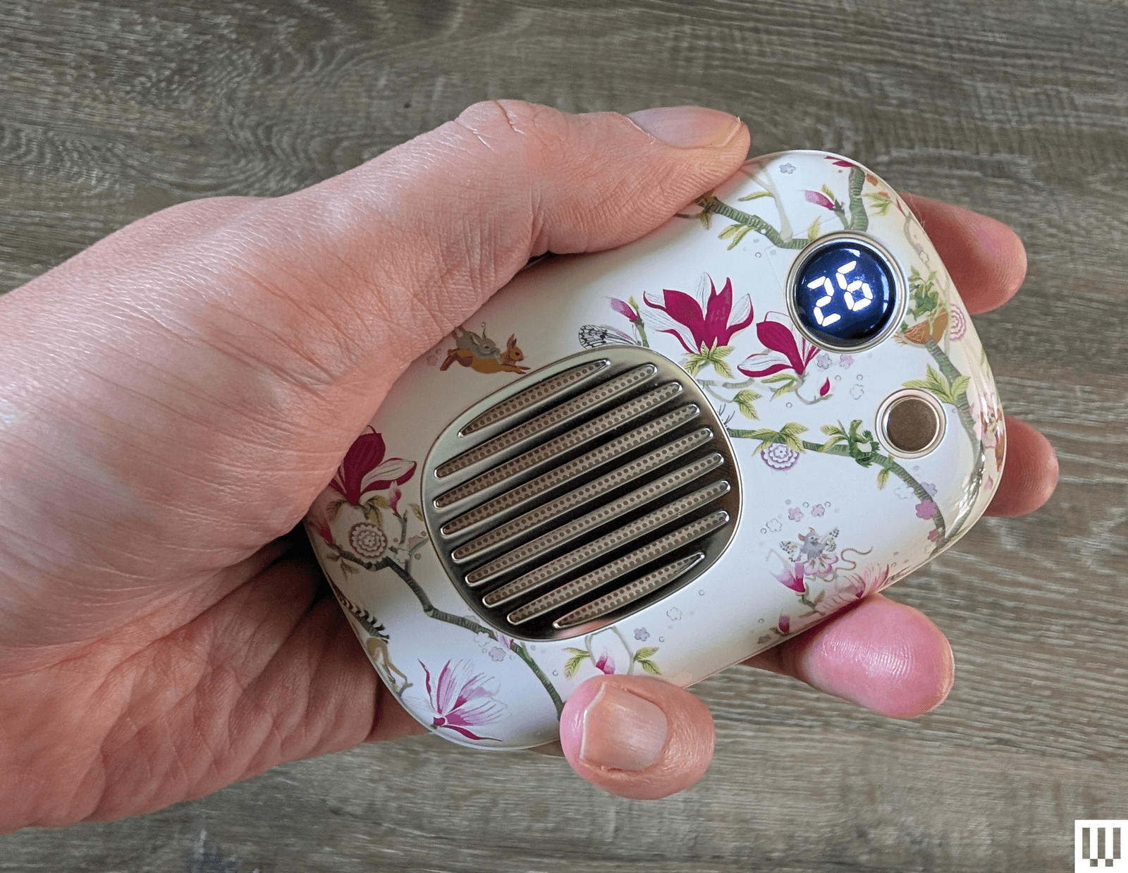 The image may contain a body part, finger, person, electronics, telephone, electrical device, microphone and cup