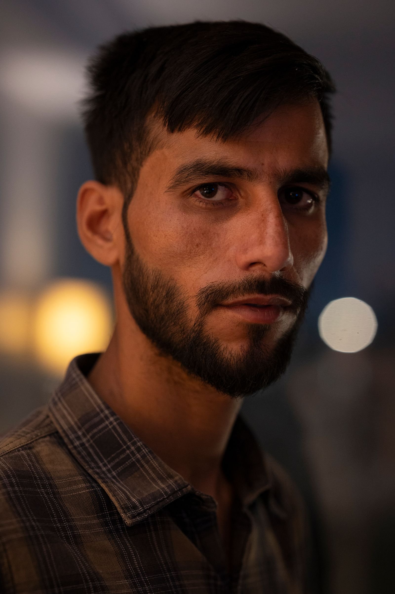 Image may contain Head Person Face Adult Crew Cut Hair Beard Photography and Portrait