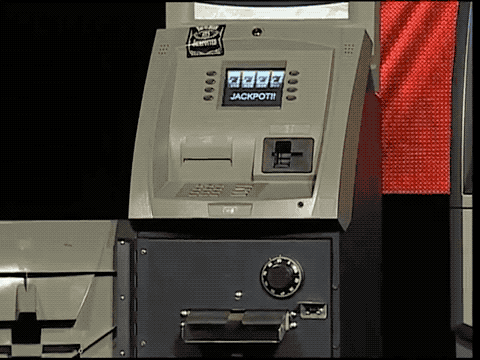 Animated GIF of an ATM dispensing cash on stage at the Black Hat conference in 2009.