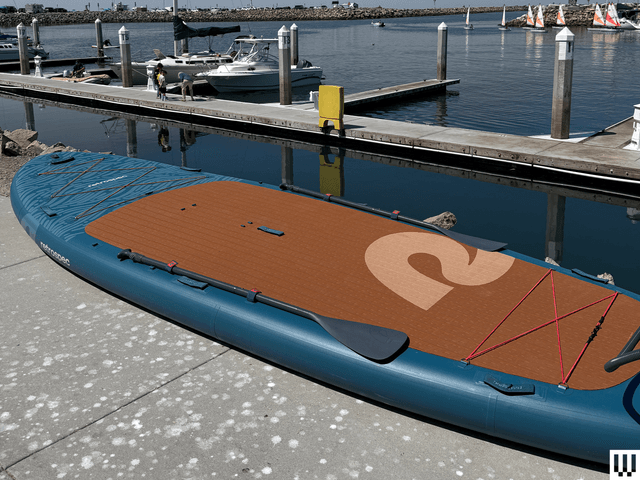 Image may contain: water, waterfront, port, transportation, watercraft, pier, boat, sailboat, person and harbor