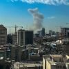 A plume of smoke rises following a reported explosion in Tehran on Saturday, February 28, 2026. Israel