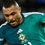 Josh Magennis is aiming to earn 100 caps for Northern Ireland with the Italy match looming