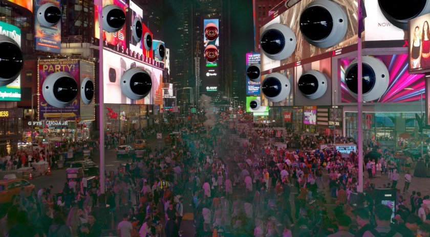 Times Square, lit up by night. Every ad sprouts a giant CCTV bubble. A green smoke crawls over the landscape.