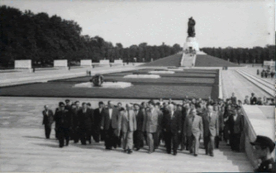Colossal Soviet soldier statue at Treptower Park War Memorial overlooking the cemetery for Red Army soldiers. Preserved barracks at the Nazi Forced Labour Documentation Centre in Schöneweide. Guard tower and crematorium ruins at Sachsenhausen concentration camp memorial. Historic UFA film studio facade in Babelsberg used for Nazi propaganda production. Crumbling brick fortifications of Fort Hahneberg in Berlin. Tempelhof Airport