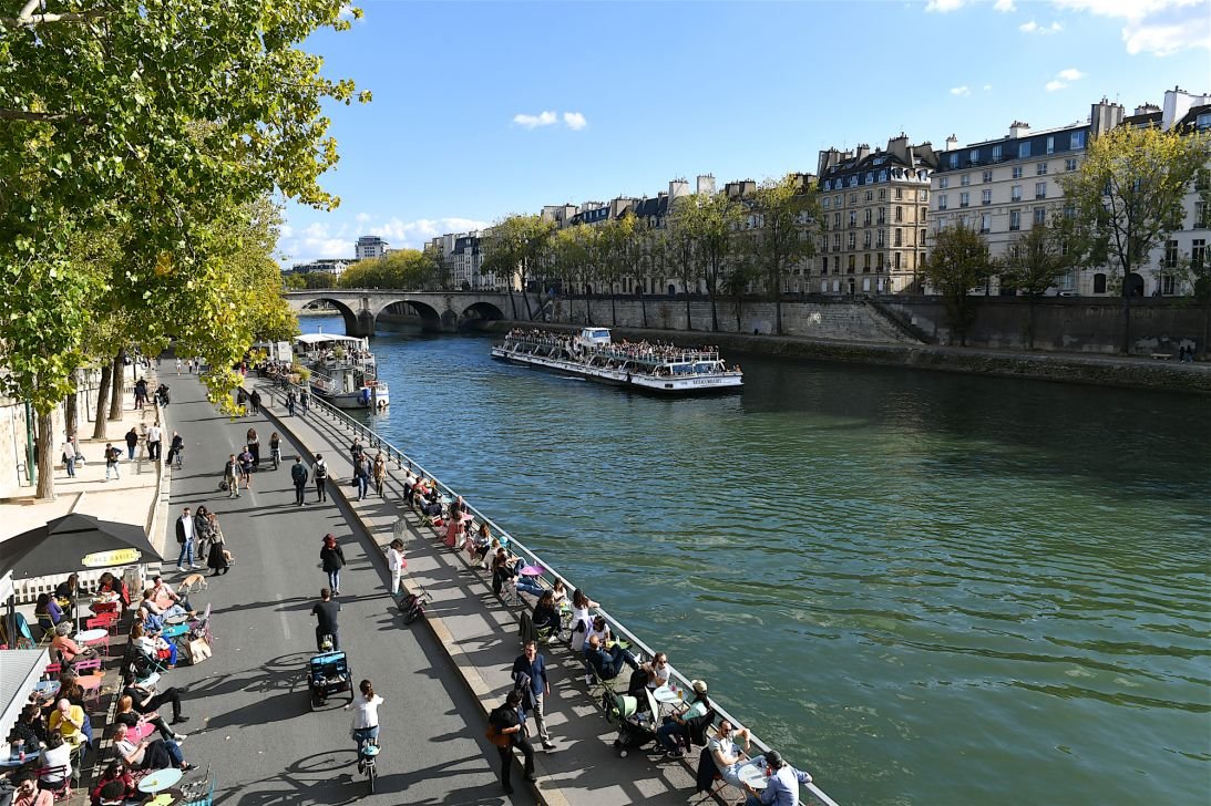 Once busy with traffic, a roadway by the Seine is now a pedestrian thoroughfare.